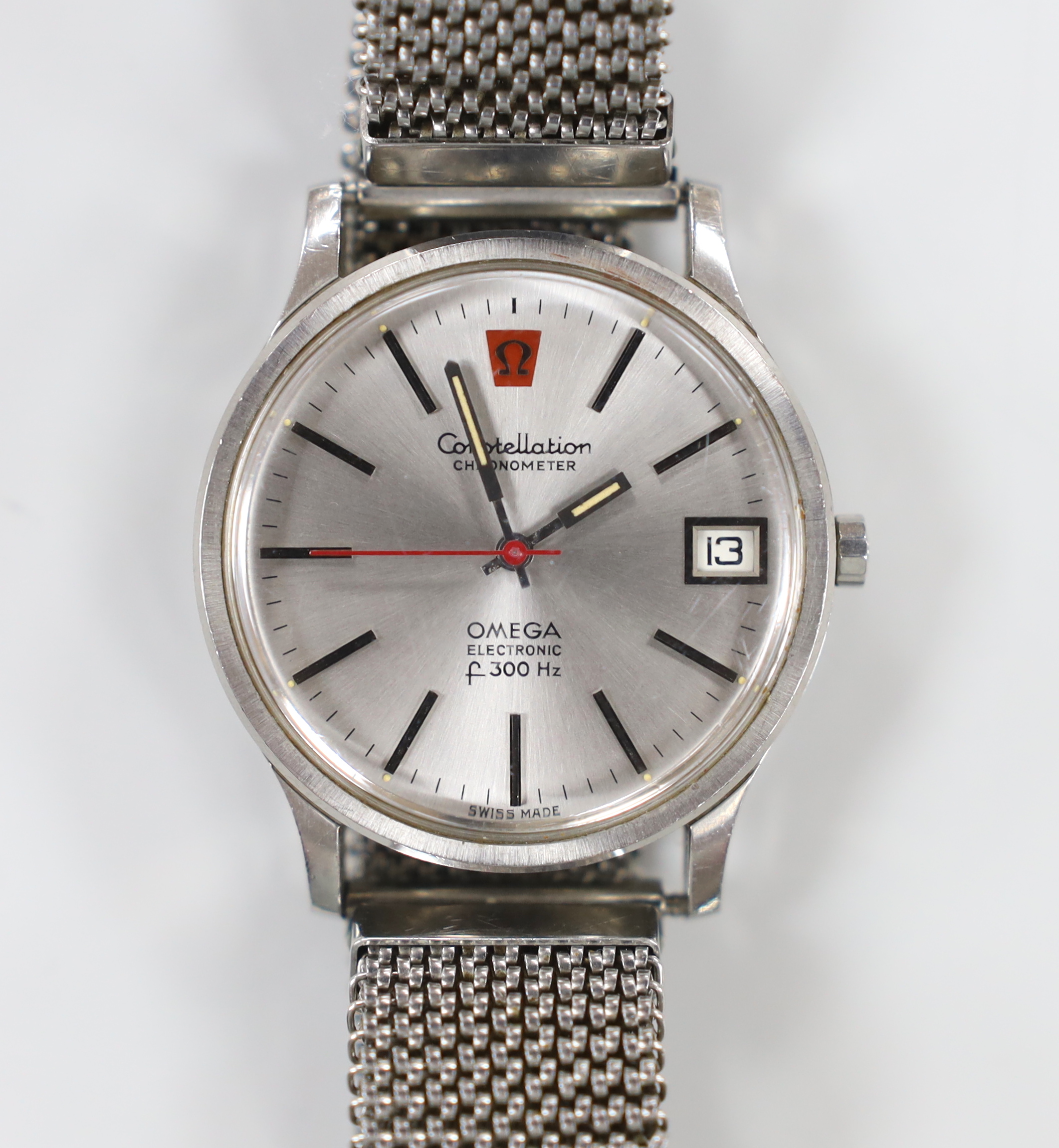 A gentleman's stainless steel Omega Constellation Electronic F300 Hz wrist watch, on an associated flexible strap.